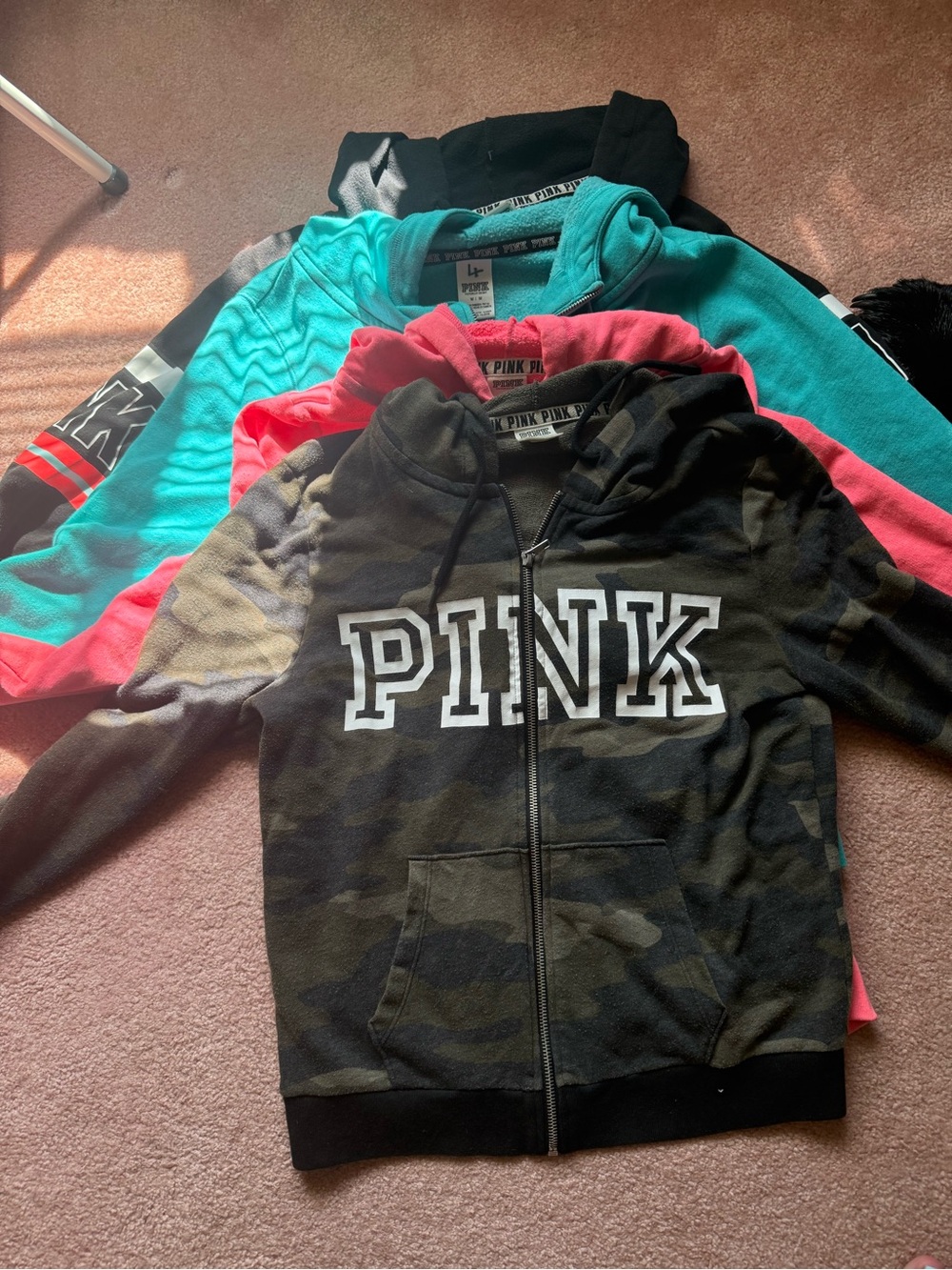 4 Pink brand zip up hoodies. Black, blue, pink and camo all in good shape